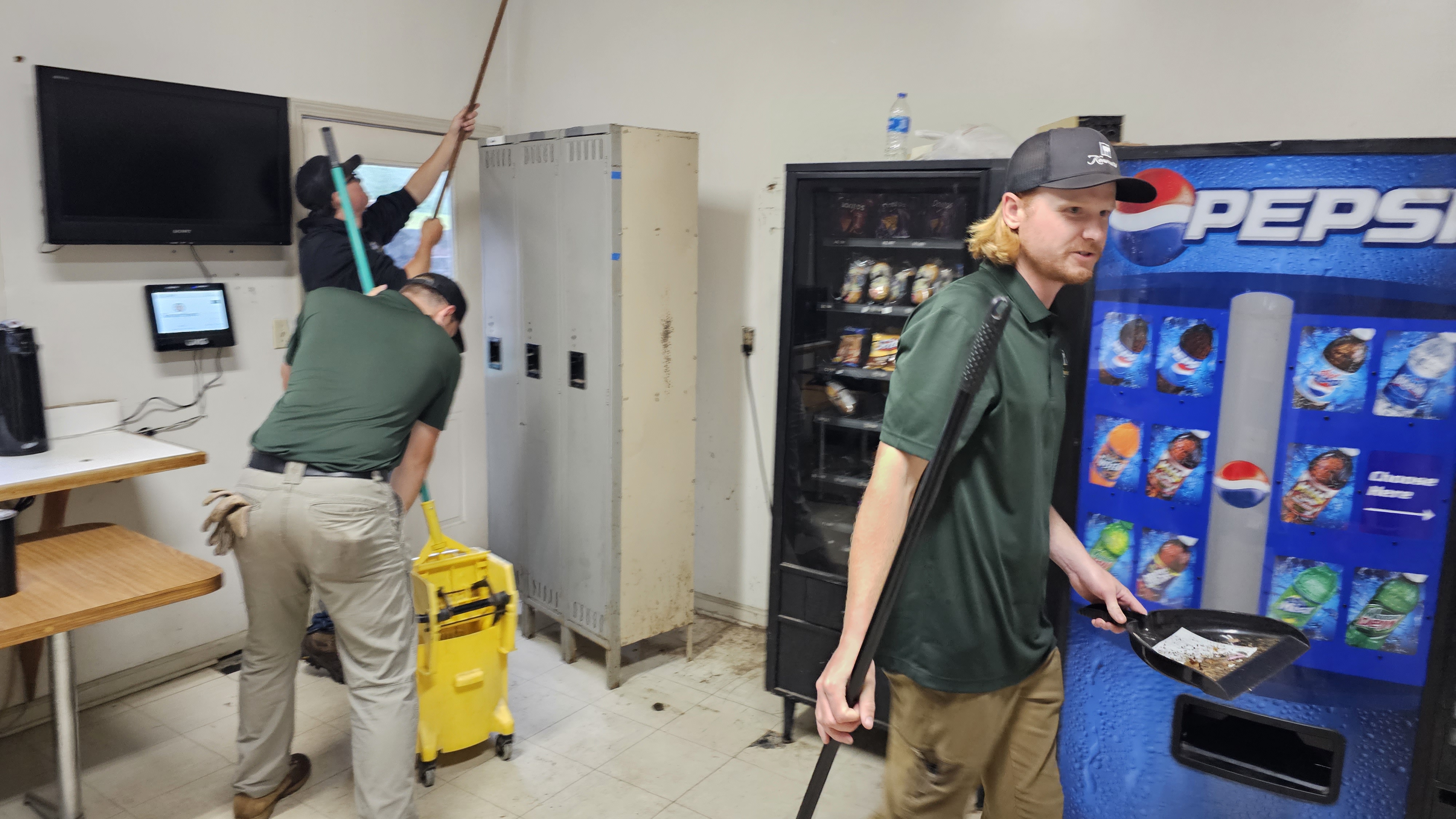 Austin and teammates organizing the maintenance shop interior