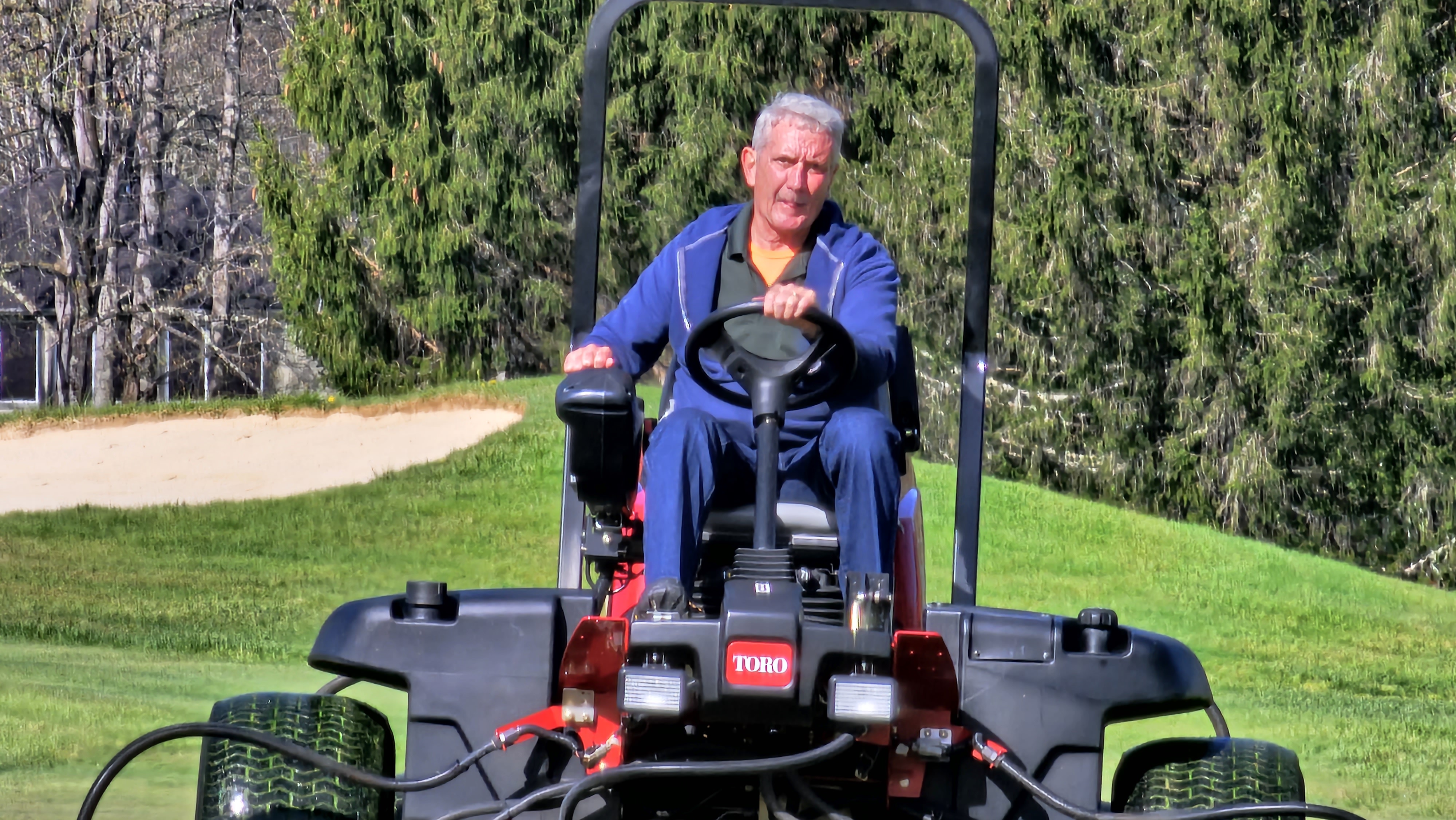 Brad operating a Toro greens mower with precise steering